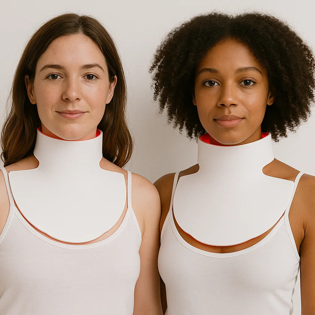 Two women wear the Noor 2.0 LED Light Therapy Neck & Chest Mask side by side against a light background.
