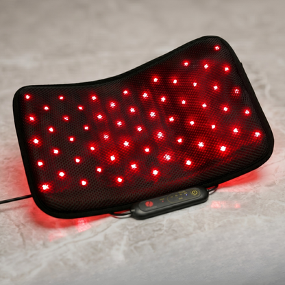 Therasage Tri-Lite™ Red Light Therapy Panel is bent into a curved shape on a stone surface, with its red lights on.