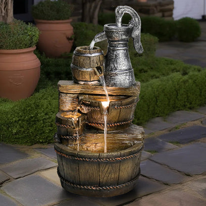 Resin Broken Barrel Rustic Outdoor Fountain 25 Inch LED pours between tiered barrels on a paved garden path.