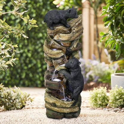 Resin Two Bear Cub Animal Outdoor Water Fountain 39 in stands among garden plants as water trickles over its rock-like tiers.