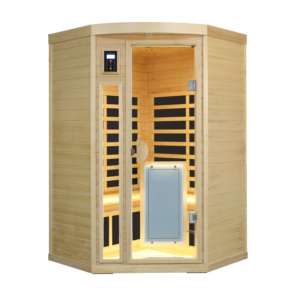 Hemlock Pentagonal Indoor Far Infrared Sauna Room with the interior lit warm yellow, viewed from the front.