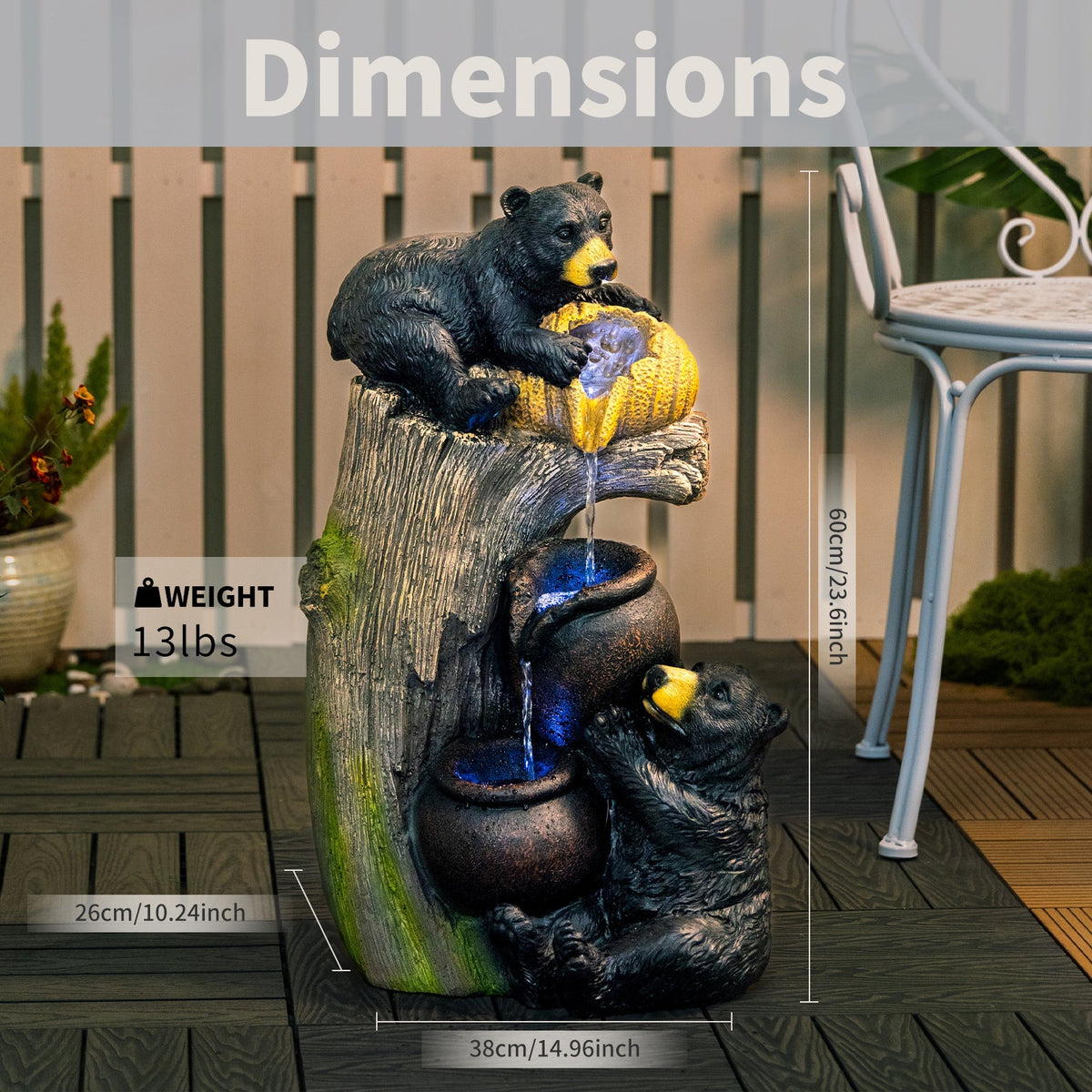 Resin Black Bear Outdoor Water Fountain with measurement guides and weight text on a deck.