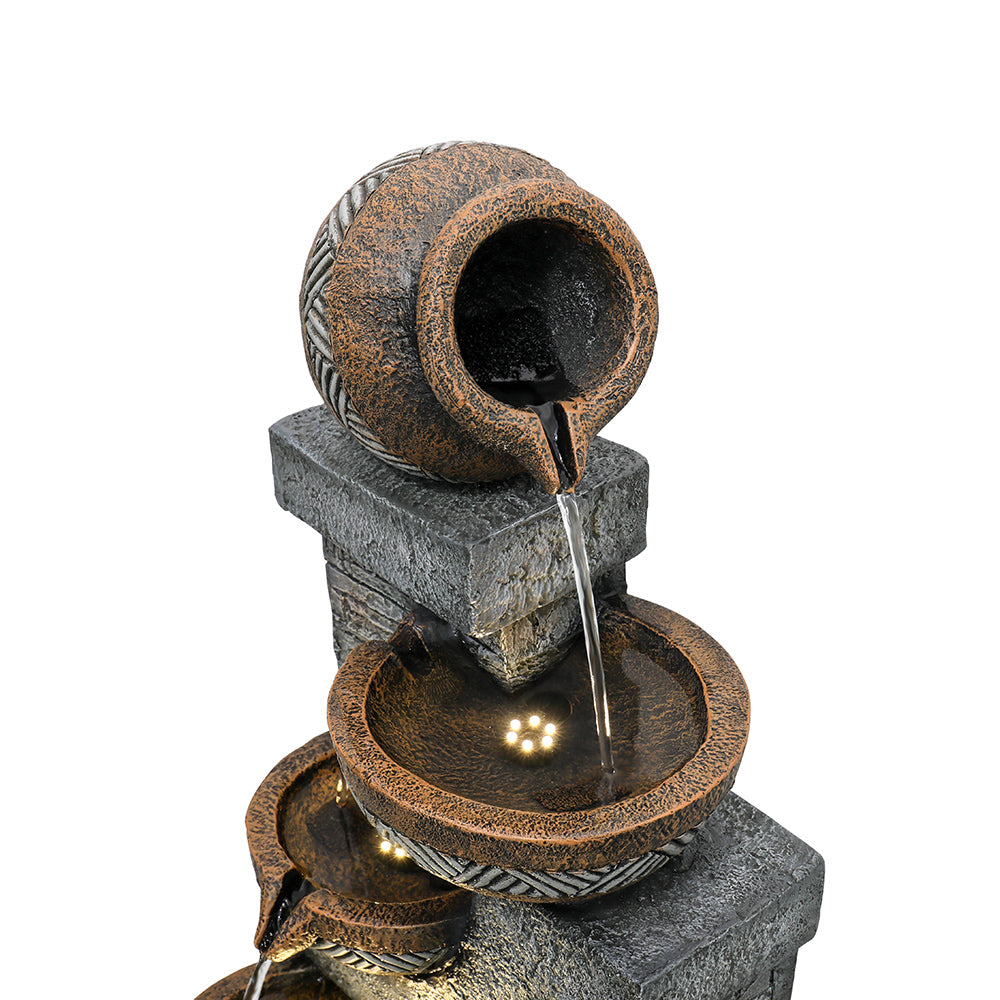 Resin Carved Clay Urn Outdoor Water Fountain 42 Inch close-up of the tilted top urn pouring into a lit bowl.