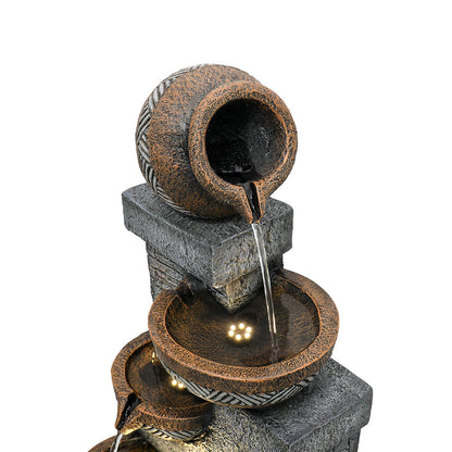 Resin Carved Clay Urn Outdoor Water Fountain 42 Inch close-up of the tilted top urn pouring into a lit bowl.