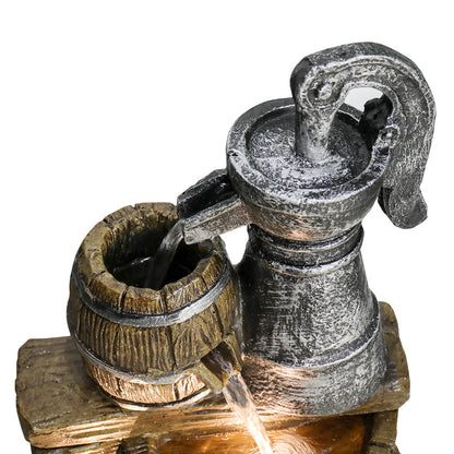 Close view of Resin Broken Barrel Rustic Outdoor Fountain 25 Inch LED's hand pump and upper barrel with water flowing.