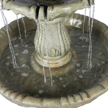 Close-up of water cascading from the middle tier into the lower basin of Concrete Water Fountain Pedestal Scalloped 3 Tier.