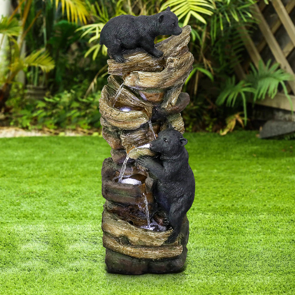 Resin Two Bear Cub Animal Outdoor Water Fountain 39 in stands upright on grass outdoors with water flowing through its tiers.