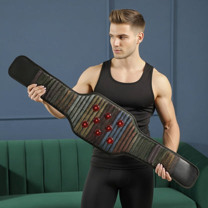 A shirtless man holds a REVA Multifunctional Infrared Heat belt in front of a green sofa.