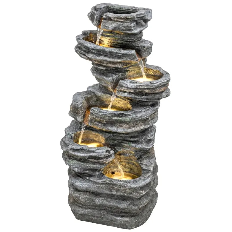 Resin 6 Tier Rock Cascade Outdoor Fountain 40 Inch LED with water flowing between lit rock tiers on a white background.