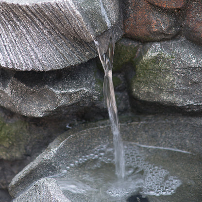 Close-up of water cascading in the Resin Fluted Basin Tiered Outdoor Water Fountain 650 GPH.