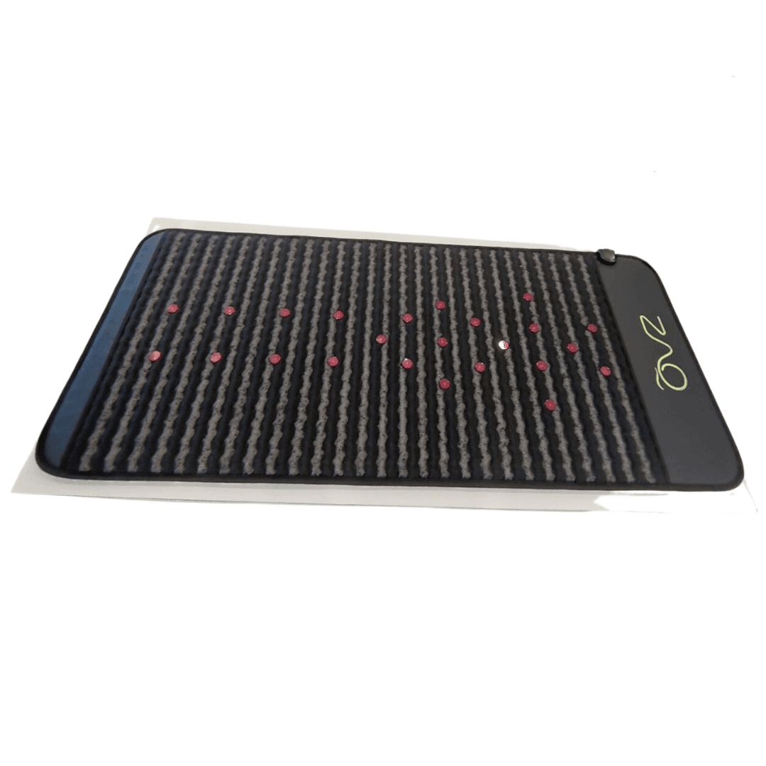 Infrared PEMF Mat shown at an angle on a white background, revealing its striped surface and red dots.