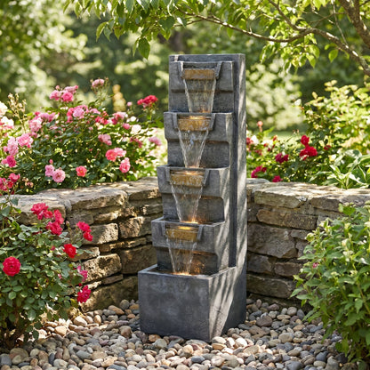 Resin Modern Outdoor Fountain 39 Inch Tilted Chutes pours through four basins among garden roses and river stones.